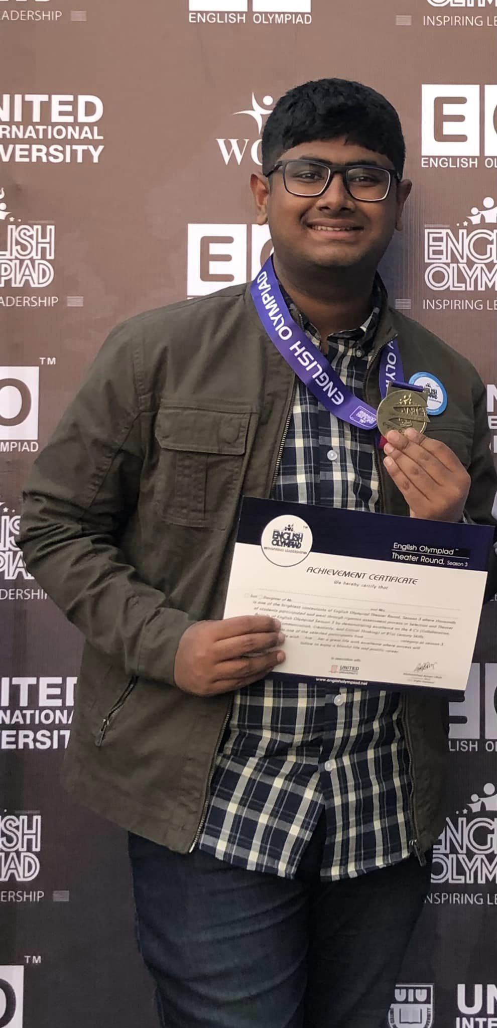 Arhab Nayeel winning a medal at English Olympiad